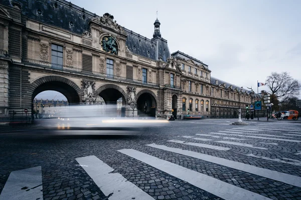Traffic moving past the Porte Des Lions, in Paris, France.