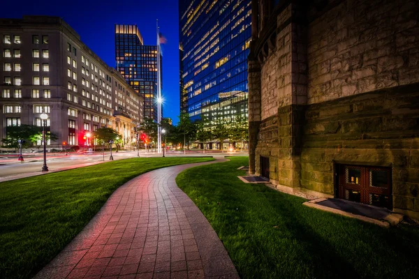 Walkway adjacent to Trinity Church and modern buildings at Cople