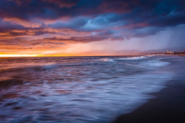 Dramatic stormy sunset and waves in the Pacific Ocean, seen at V