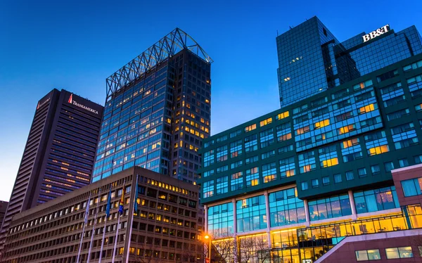 Buildings on Pratt Street at twilight, in Baltimore, Maryland.