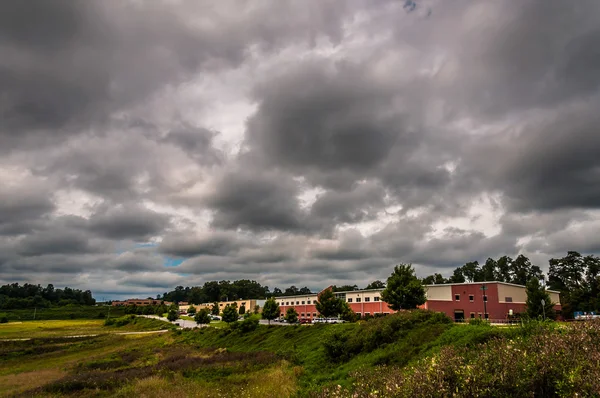 Storm clouds over buildings in an industrial park in York County
