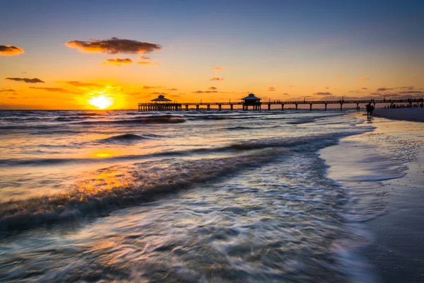 Sunset over the fishing pier and Gulf of Mexico in Fort Myers Be