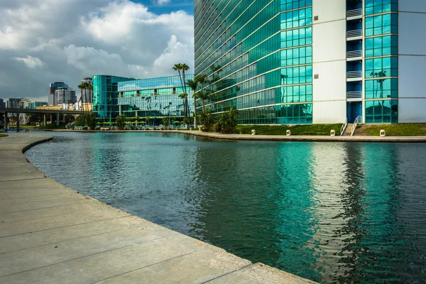 Modern building and lake at Rainbow Lagoon Park in Long Beach, C