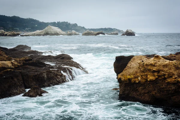 View of rocks and waves in the Pacific Ocean at Point Lobos Stat
