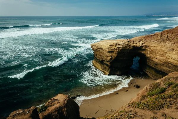 Cave and cliffs along the Pacific Ocean at Sunset Cliffs Natural