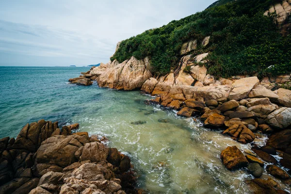 Rocky coast at Shek O Beach, on Hong Kong Island, Hong Kong.