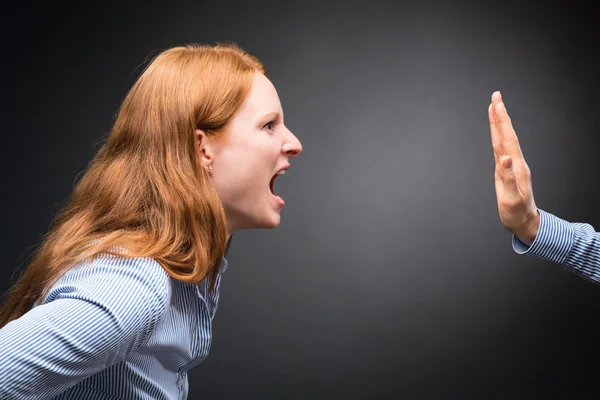 Angry Woman Shouting at a Hand