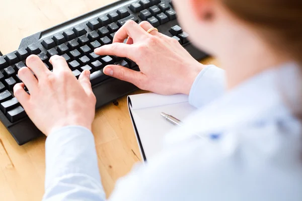 Businesswoman Typing on a Keyboard