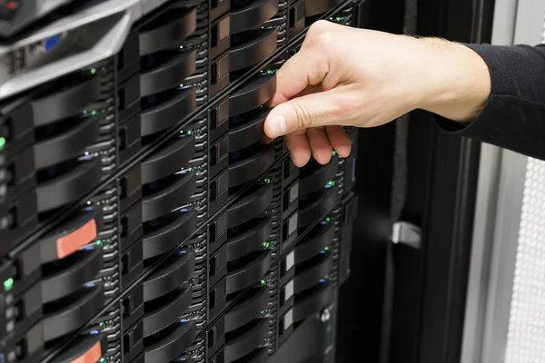 Male IT Technicians Hand Replacing Hard Drive In San