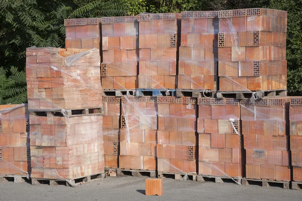 Wooden pallet with bricks.