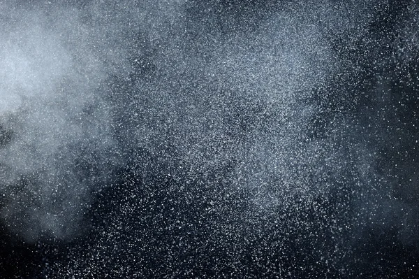 Abstract white powder explosion.