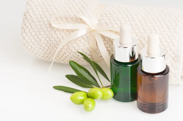 Spa theme - olives, towel and cosmetic oil