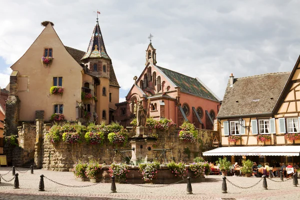 Castle, church and fountain named Saint Leon in Eguisheim village in France