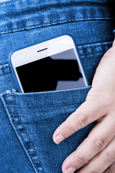 White phone in jeans back pocket