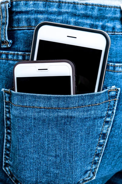 White phone in jeans back pocket