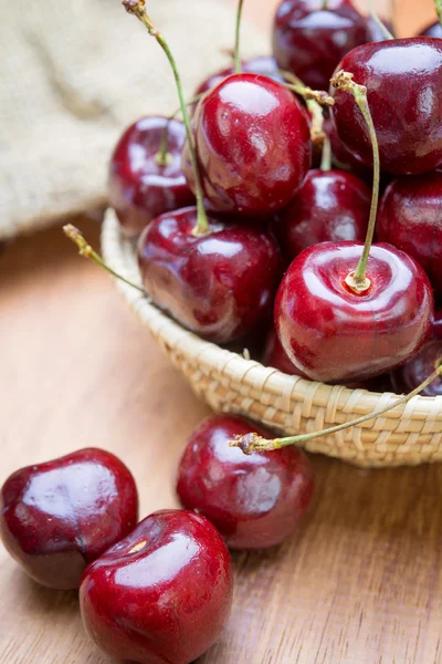 Fresh red Cherries on wooden table