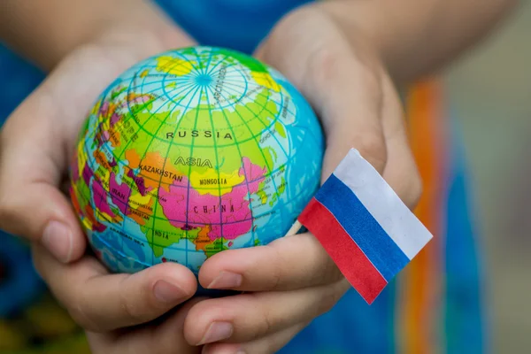 Globe in hand with the Russia