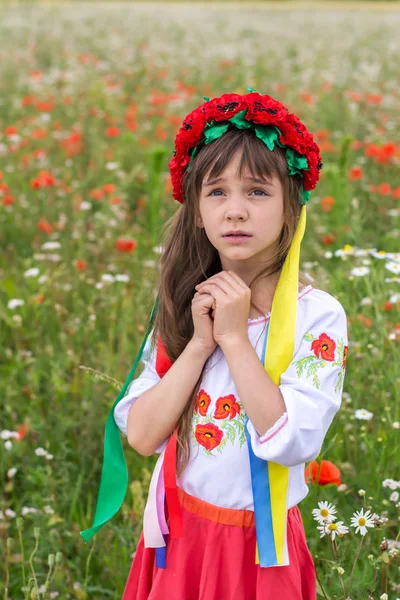 Little Ukrainian girl pray for peace