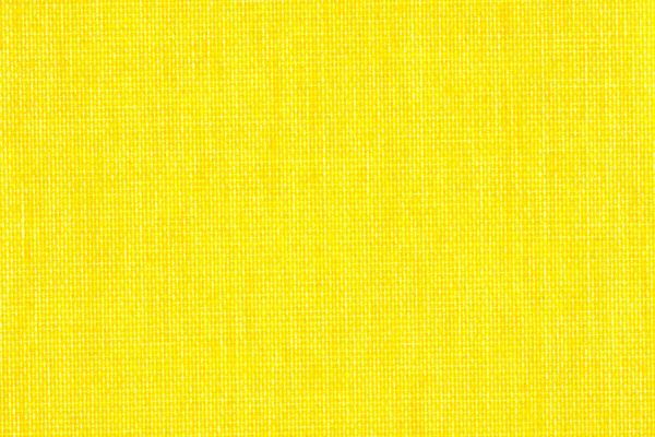 Background texture of bright yellow fabric closeup