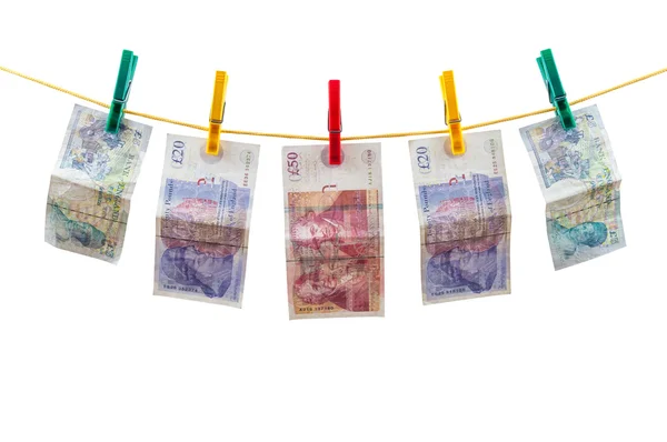 在晾衣绳上的英语英镑钞票。 - 图库照片mkos