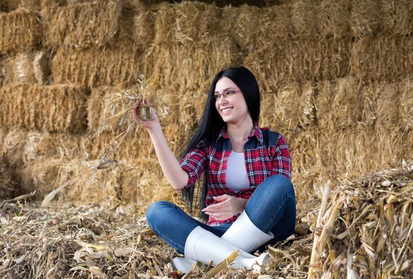 Happy country woman on the straw