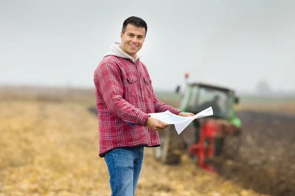 Farmer with bank forms
