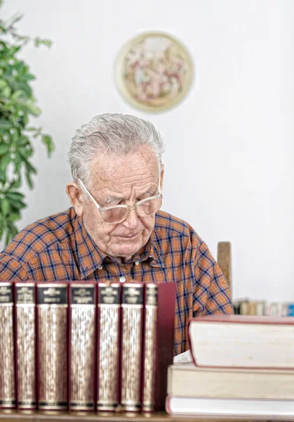 Senior man in library