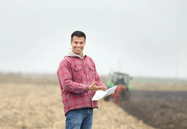 Happy farmer on the field