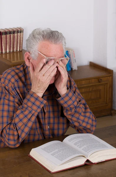 Old man reading a book