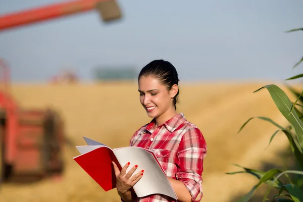 Woman agronomist in wheat field