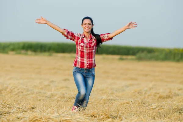 Happy girl running in the field