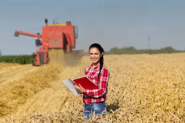 Woman agronomist in wheat field