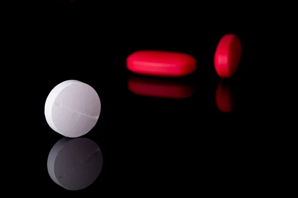 Pills on black background