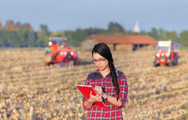 Farmer girl on corn harvest