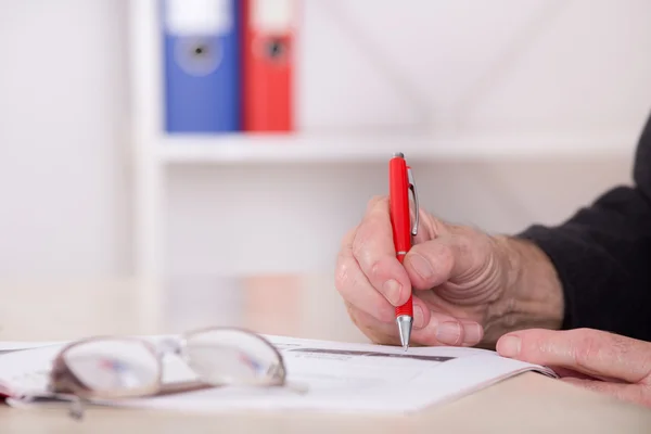 Businessman writing notes in the office