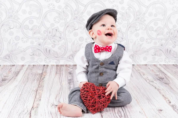 Baby with red kiss and heart