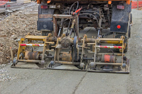Plate compactor mounted on truck compacting gravel 2