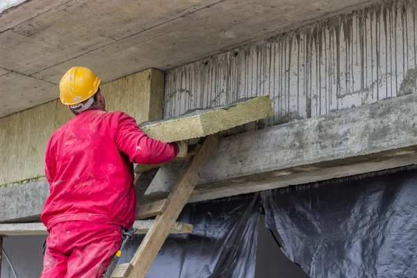 Man installing external wall insulation 2