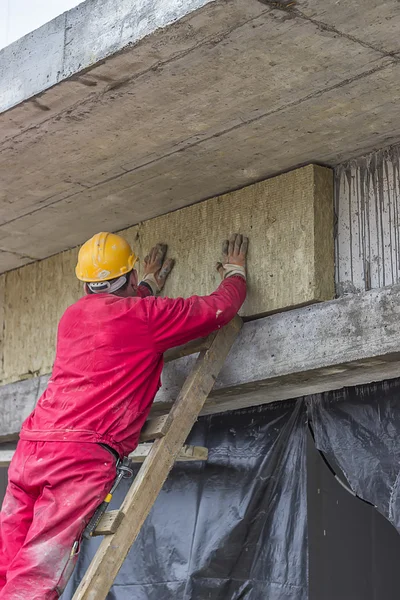 Man installing external wall insulation 3