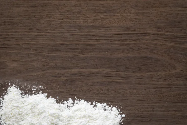 Baking background, flour on vintage wood table