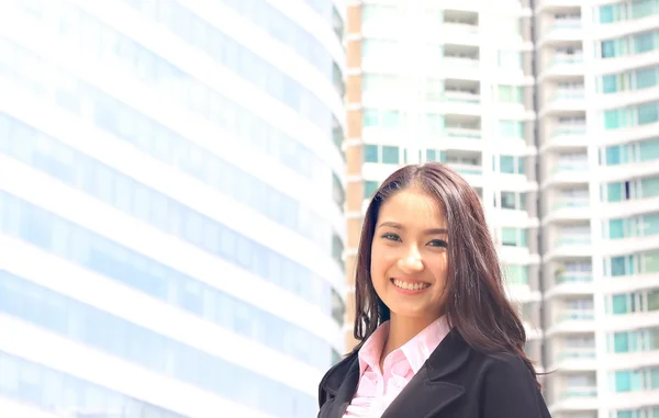 Close up portrait of Asian woman in business suite