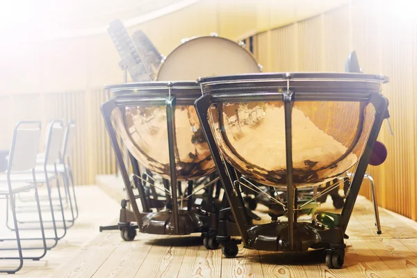 Group of classical percussion instruments on a large wooden stage