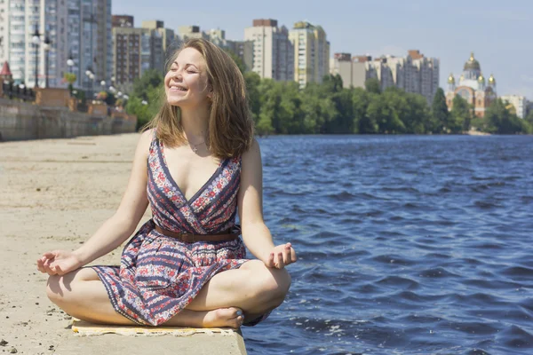 Beautiful smiling girl relaxing on nature.Face of a beautiful young girl. Portrait outdoors.