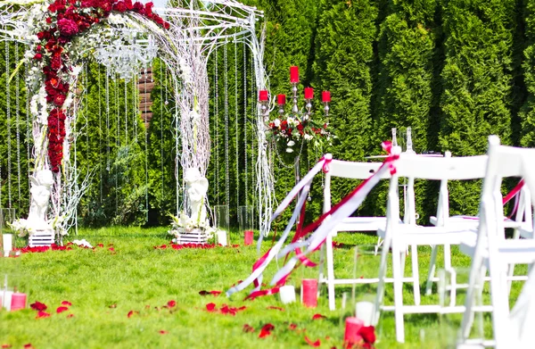 Wedding arch outdoors. Natural flowers. Decor. Floristics. visiting ceremony