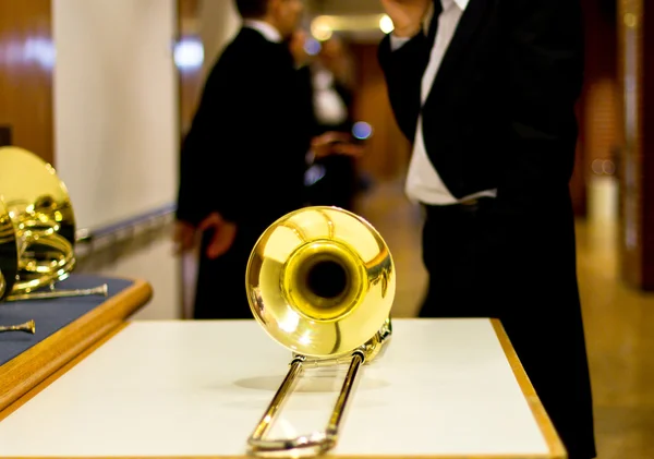 Gold trombone behind the scenes. Musical instrument. Trombone. Wind instrument. before the performance