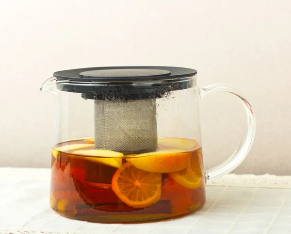 Glass teapot with black tea. Ginger tea with cinnamon. Tea for Health