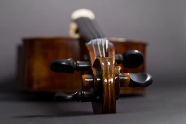 Old Violoncello on a black background. Musical instrument. Stringed musical instrument. cello