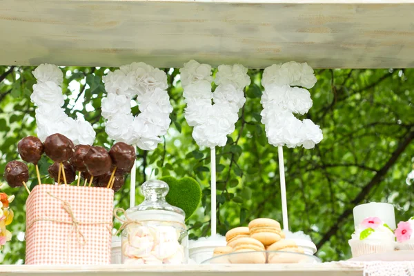 Wedding feast. Banquet. Sweets for wedding table.French macaroons.Candy bar.Wedding feast. Wedding sweets