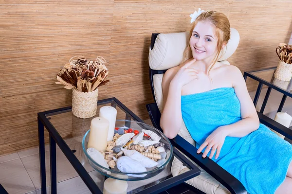 Young happy beautiful girl in spa salon relaxing in the relaxation room. beauty portrait