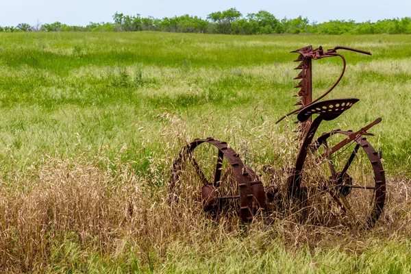 Rusty Old Texas Metal Farm Equipment in Field